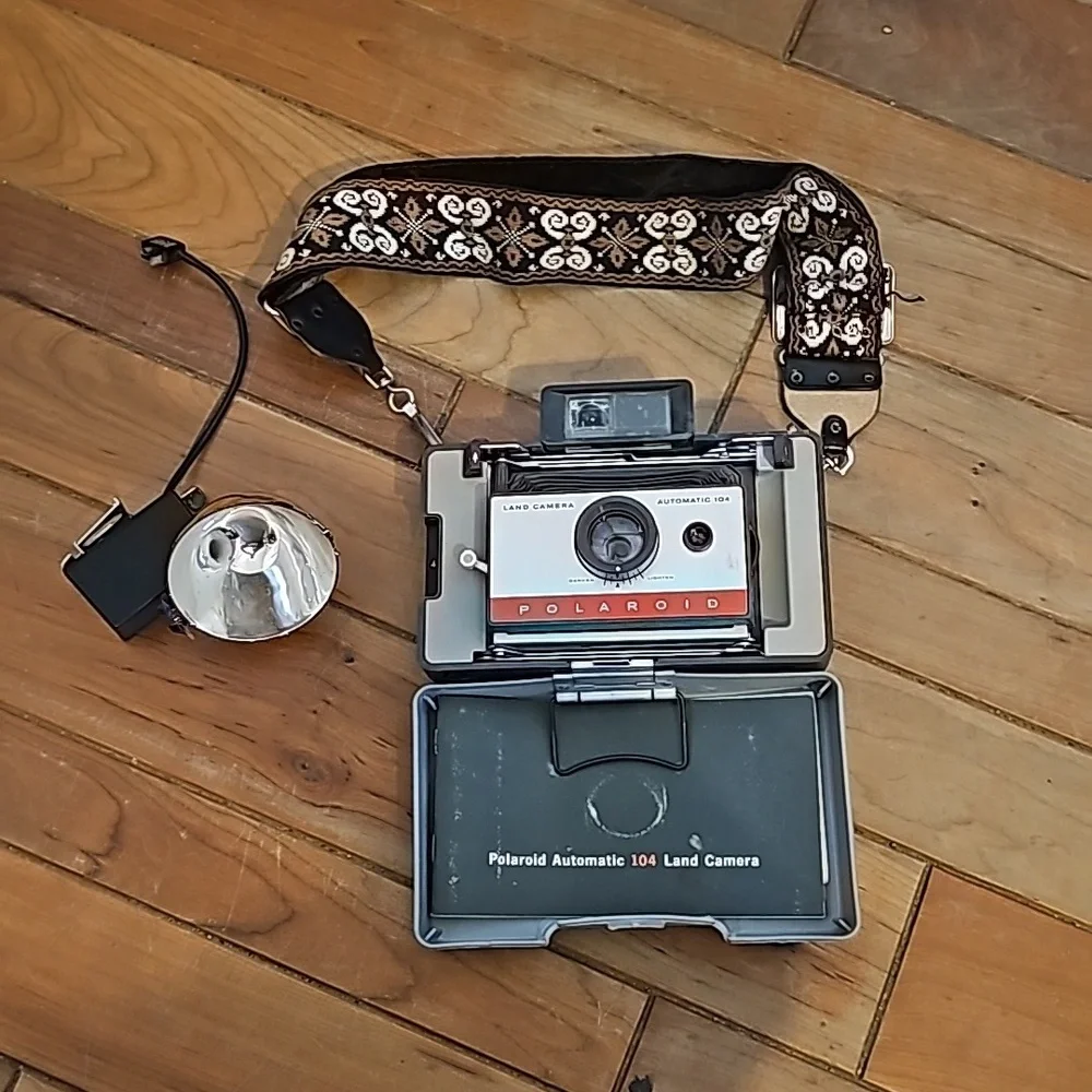 Vintage Polaroid automatic 104 land camera with beautiful strap